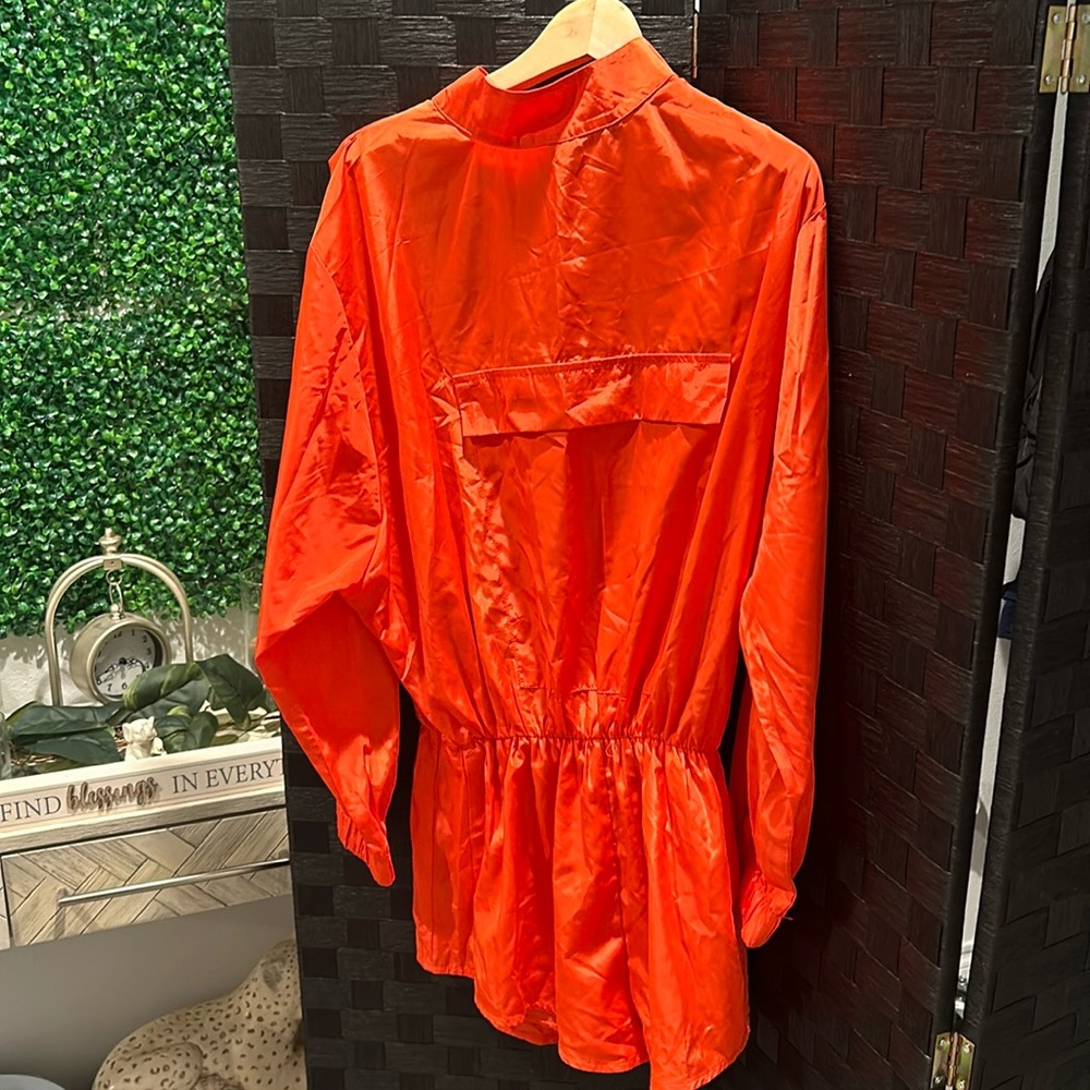 Orange romper by Akira